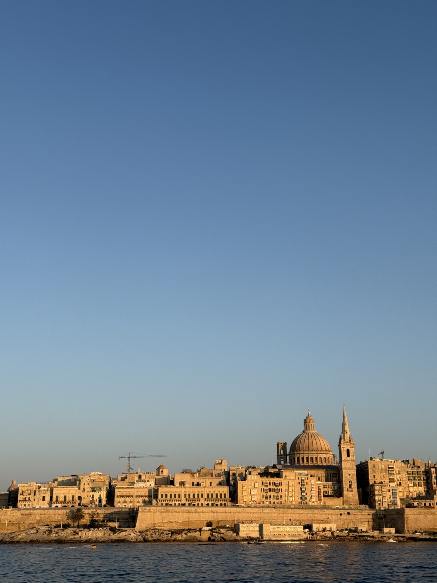 Valletta skyline at golden hour seen from the water